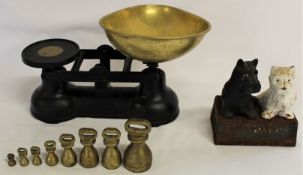 Cast iron balance weighing scales with 8 weights and a Buchanan's Black & White Scotch Whisky cast