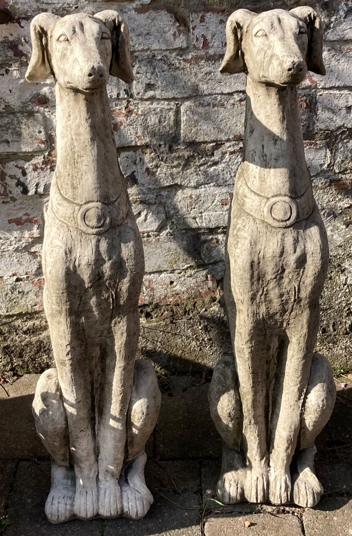 Pair of large greyhound garden ornaments