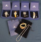 4 boxed Swarovski crystal watches and watch and necklace set