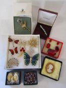 Collection of brooches includes spider, butterfly peacock also Swarvoski crystal rose brooch etc