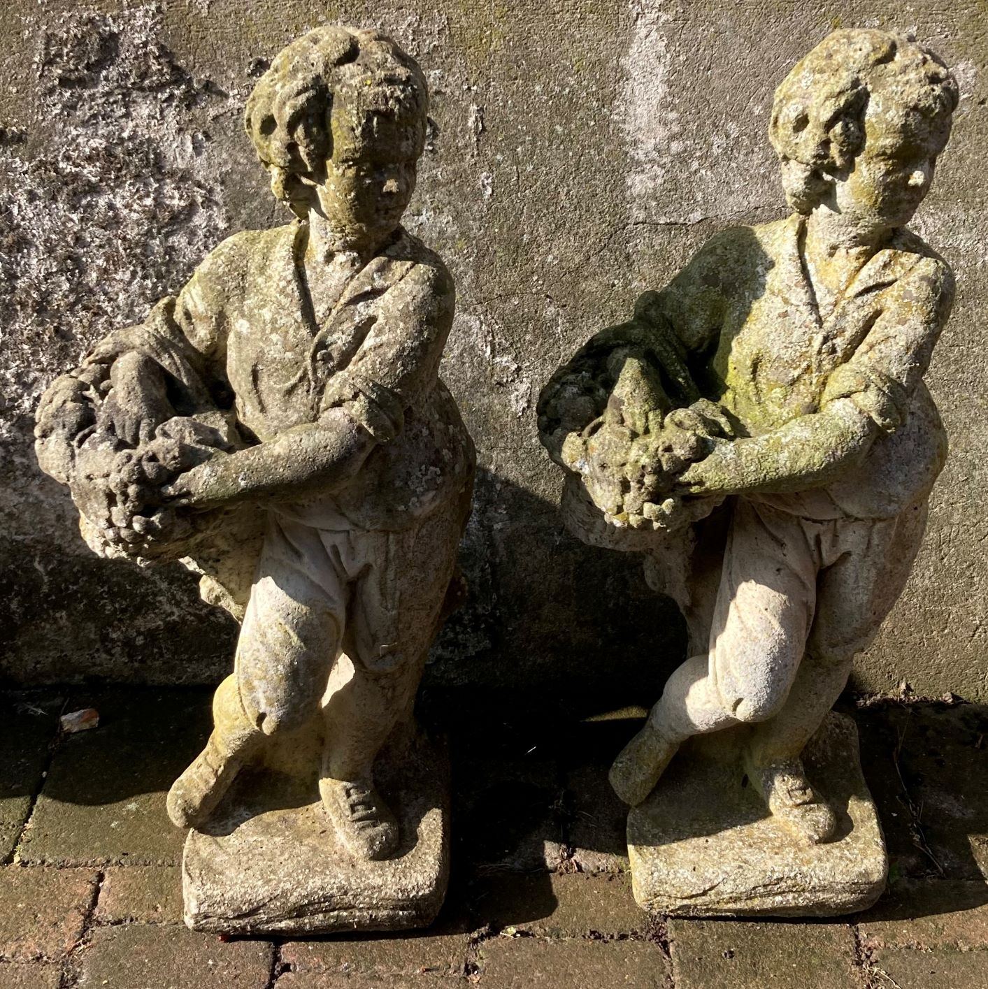 Pair of concrete gardener figure statues