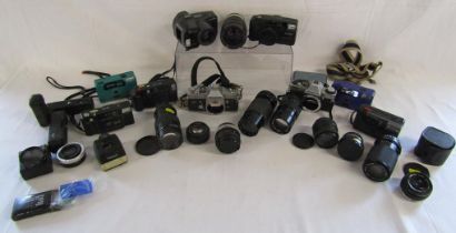 Collection of cameras includes le clic, Canon, Olympus and lenses includes super-paragon, tefnon,