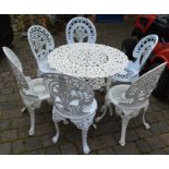 Cast alloy table and 4 chairs and two other cast chairs