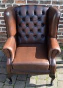 Brown leather button back armchair