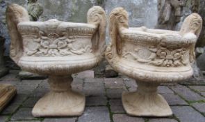 Pair of concrete twin handled urns