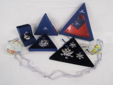 Swarovski crystal Christmas decorations include Santa, 2004 star trio and 2002 star (one piece