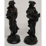 Two bronze effect figurines, height 28cm