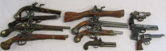 15 replica guns, including pistols, blunderbuss, etc