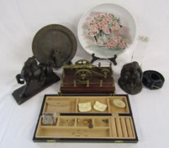 Collection of items includes wooden horse, mounted brass cannon, sundial, Heredities figure, hand