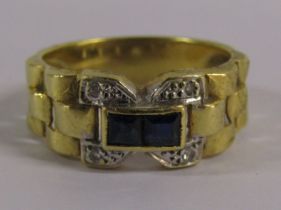 18ct gold ring marked 750 set with 2 square cut sapphires and diamonds - ring size L and total