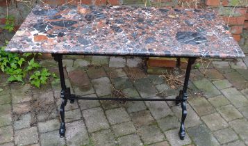 Marble top table on a cast iron base 120cm by 60cm Ht 72cm