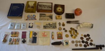 Various military items, including dress medals, reproduction medals, buttons, badges, wooden plaque,