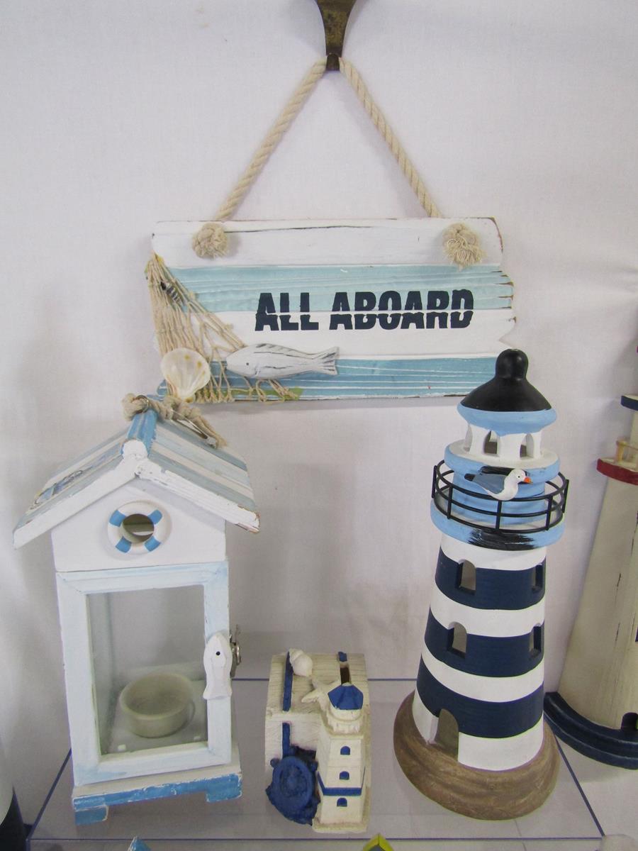 Collection of wooden beach ornaments includes, clock, lighthouses, beach hut money boxes, candle - Image 3 of 8