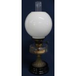 19th century paraffin lamp with clear glass reservoir & opaque glass shade on black glazed base