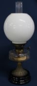 19th century paraffin lamp with clear glass reservoir & opaque glass shade on black glazed base