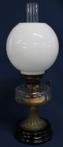 19th century paraffin lamp with clear glass reservoir & opaque glass shade on black glazed base