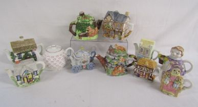 11 teapots includes florist, Sadler, carriage, The Village squirrel scene and Coach House,