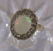 9ct gold opal surrounded by Cubic Zirconia ring - ring size F - total weight 2.62g