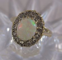 9ct gold opal surrounded by Cubic Zirconia ring - ring size F - total weight 2.62g