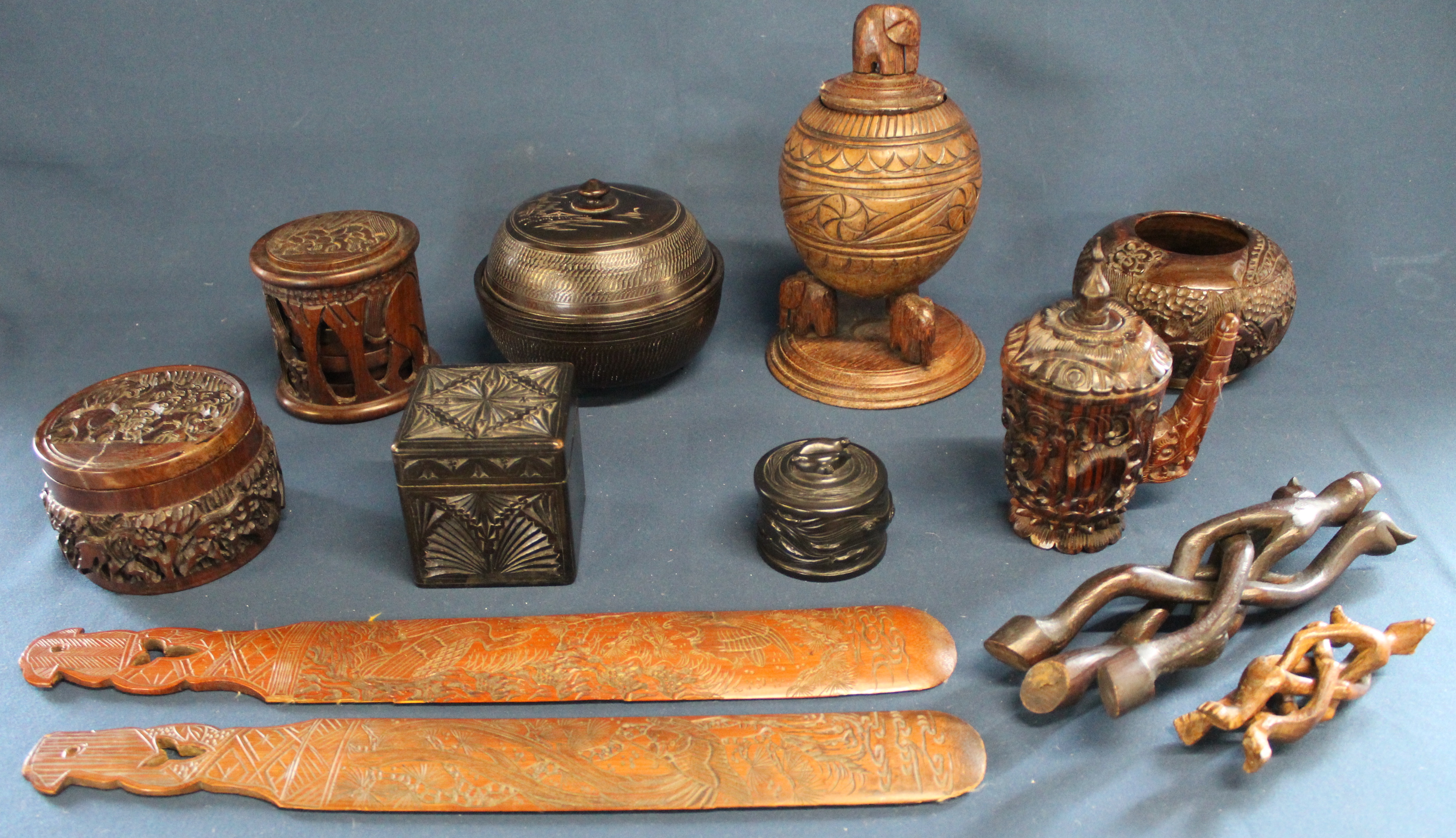 Selection of Continental carved wooden items including Canadian seal pot, sets of coasters & 2