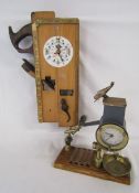 2 unique clocks one with woodworking tools and one with brass aeroplanes and Alexanderwerk frame