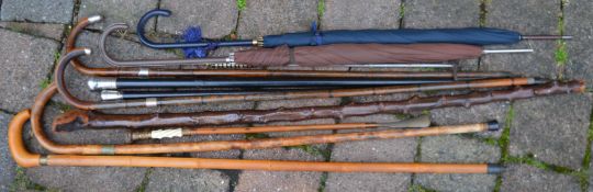 2 Fox & Co. umbrellas, walking sticks (4 with silver embellishments), shoe horn & a toasting fork