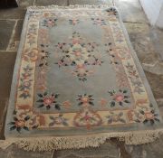 Chinese green ground wool rug, 191cm by 122cm