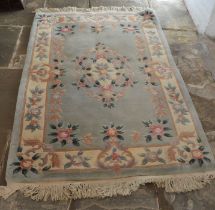 Chinese green ground wool rug, 191cm by 122cm