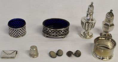 Selection of silver, including pepper pots, salts, napkin ring, envelope stamp case, thimble and