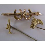 9ct gold horseshoe brooch, 9ct gold horsehead tie-pin and 9ct gold fox head and whip with gilt pin