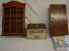 One Button Radio for elderly, glass display cabinet, wooden cupboard and a box in book design