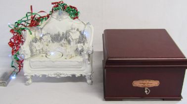 Christmas Gallery Village Scene magnetic music box and a David Fischhoff Christmas chair with lights