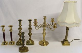 Brass candlesticks, candelabra and lamp