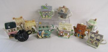 11 teapots include George and the Dragon and Red lion pub, butcher, Anne Hathaway's cottage,