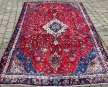 Red ground Persian Najafabad carpet 277cm by 191cm