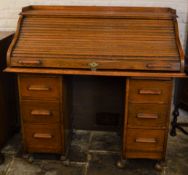 Early 20th century tambour front oak desk L121cm Ht 120cm D 57cm