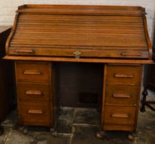 Early 20th century tambour front oak desk L121cm Ht 120cm D 57cm