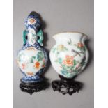 A Chinese famille verte wall pocket with flower and bird decoration, and hardwood stand, 5 3/4" high