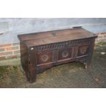 An early 18th century carved oak triple panel front coffer, on panel end supports, 43" wide x 16"