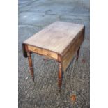 A 19th century mahogany Pembroke table, fitted one drawer, on turned supports, 36" wide x 41" deep x