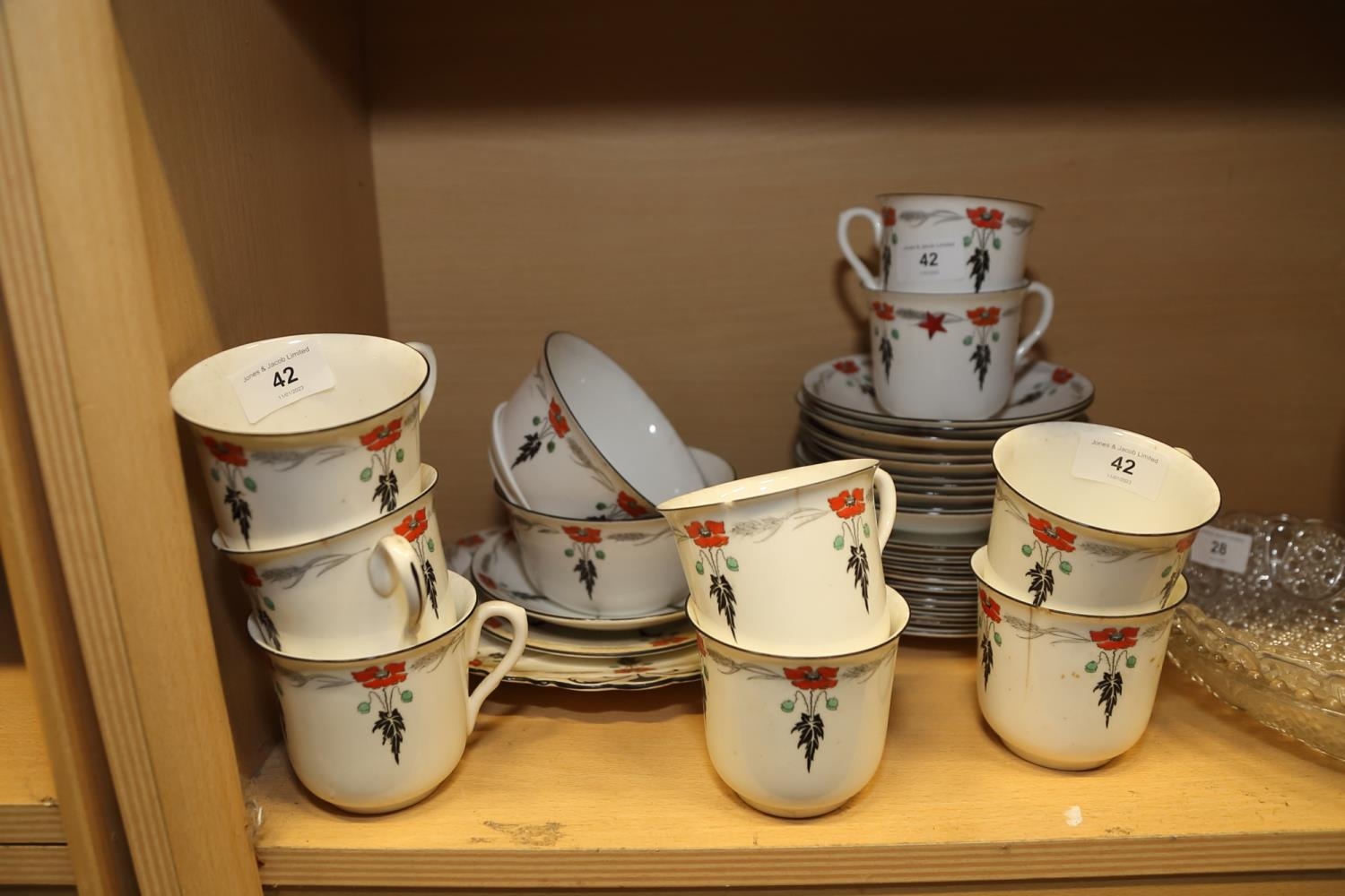 A Shelley teaset, comprising nine cups, eleven saucers, eleven side plates, one larger plate and two - Image 3 of 3