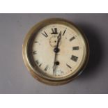 An Armstrong of Manchester brass cased bulkhead clock with Roman numerals and enamelled dial, 7 1/2"