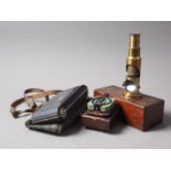 A Meridian Dendrometer, in leather carry case, a Kodak camera and a brass microscope, in box