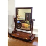 A 19th century mahogany swing frame toilet mirror, on plateau base, 16 1/2" wide