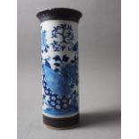 A Chinese blue, white and unglazed cylindrical flared rim crackle glaze vase with bird and tree