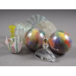 A pair of glass baubles with multi-coloured spray decoration, two Venetian glass plates, a similar