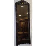 A Chinese carved hardwood framed wall mirror, 35" x 12" overall