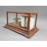 A wooden and glass cased barograph, by A & N C S Ltd, Westminster