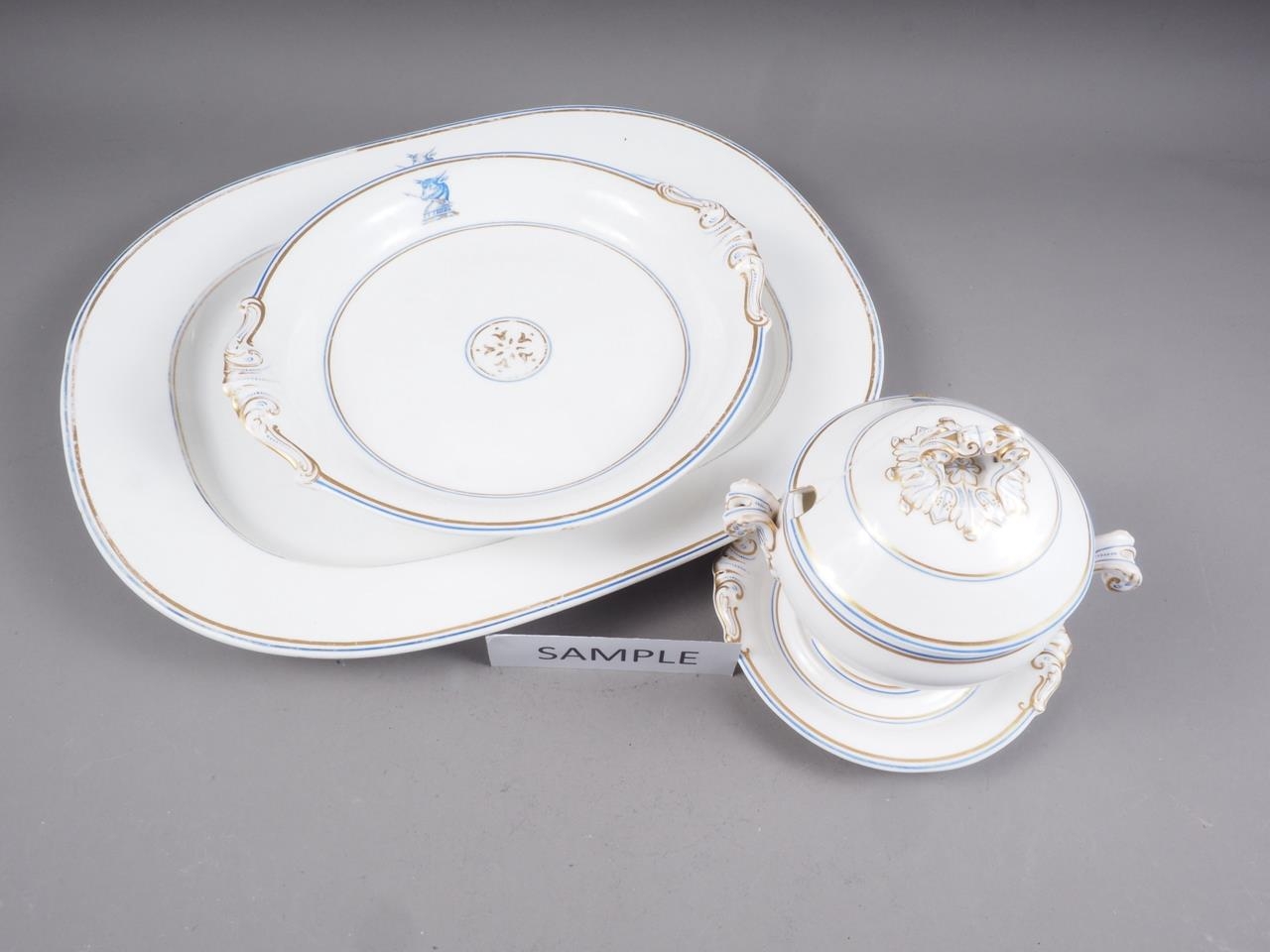 A 19th century Coalport bone china part dinner service with bull's head crest