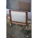 A late 19th century mahogany swing frame toilet mirror with reeded frame, on skeleton stand, 18"